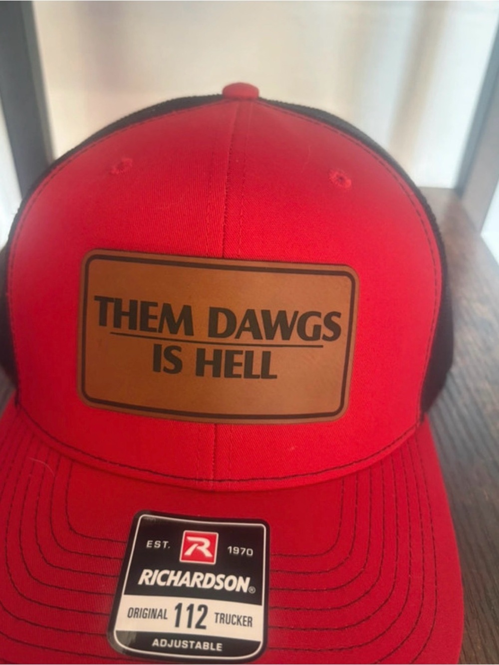 Red Trucker Hat with "Them Dawgs Is Hell" Patch